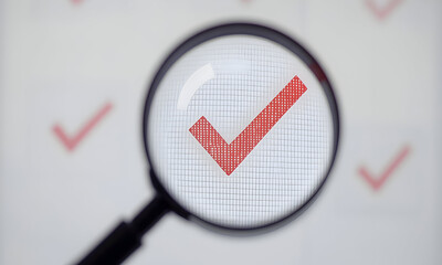 Magnified red checkmark symbol