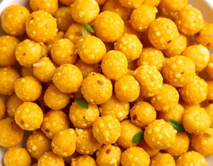 Traditional Indian sweet Laddu (Ladoo) made from gram flour, garnished with curry leaves, served fresh and perfect for festive celebrations and cultural occasions.