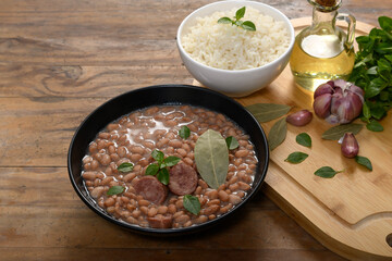 Brazilian beans with sausage and rice, side dishes and presentation