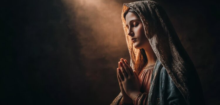 Mother Mary with hands in prayer, glowing aura