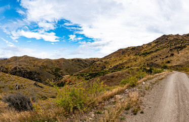 Central otago new zealand rural scene landscape hills mountains wide vista scenic beautiful