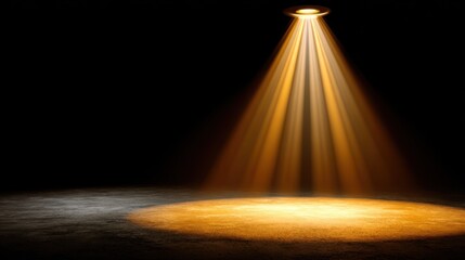 Bright golden spotlight illuminating center of empty stage amid backstage shadows