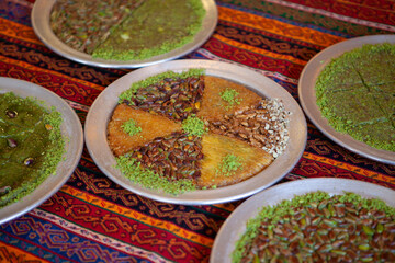 Traditional kunefe dessert with melted cheese and syrup – Turkish sweet pastry kunefe close-up