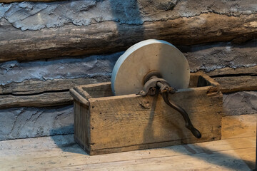 A hand-operated stone grinding wheel