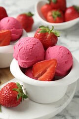 Refreshing sorbet and strawberries on white marble table, closeup