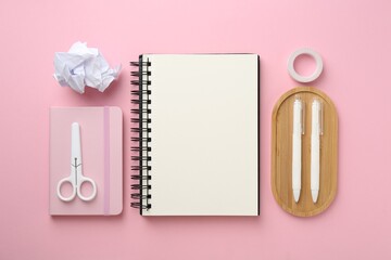 Flat lay composition with notebooks on pink background