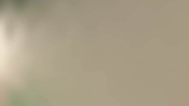 Unscharfer, neutralfarbener Hintergrund mit Lichteinfall