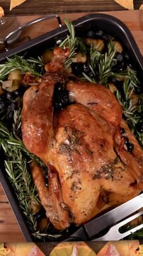 Animation of autumn leaves and thanksgiving turkey dinner background