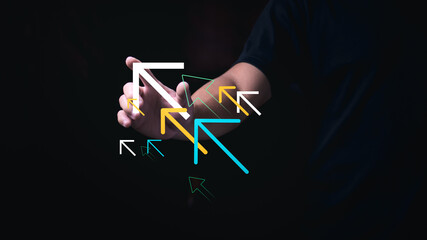 A man is showing his pointing at the tip of an arrow to signify the progress or growth of the...