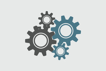 Illustration of four gears of different sizes and colors on a plain light gray background surface
