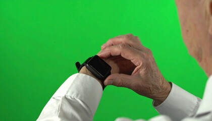 Senior person wearing a smart watch, adjusting the time or function.