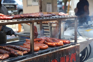 Lively summer scenes from a ribfest celebration featuring sizzling barbecue, smoked meats, and food vendor culture. A feast of flavor, fire, and community under warm seasonal skies in Columbus, Ohio.