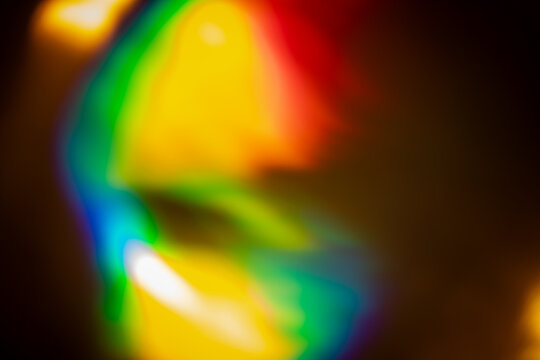 light leak overlay effect with abstract colorful light leaks,retro grain noisy film distressed texture light leak flare on black background,old film projector