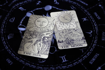 Mystical atmosphere captured through a detailed tarot card arrangement on a textured surface. Rich symbolism and traditional esoteric themes evoke intuition, divination, and spiritual insight. Ideal f