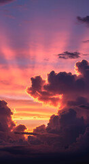 Beautiful sunset sky with sun rays breaking through pink, purple, orange clouds