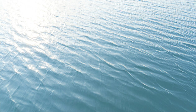 Peaceful body of water with subtle motion and gentle ripples reflecting soft sunlight, creating calm and serene natural surface perfect for relaxation and outdoor scenery