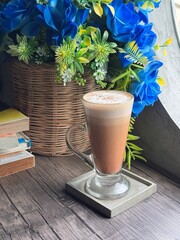Classic Cappuccino with Perfect Foam and Cocoa Dusting in Minimalist Glass Cup