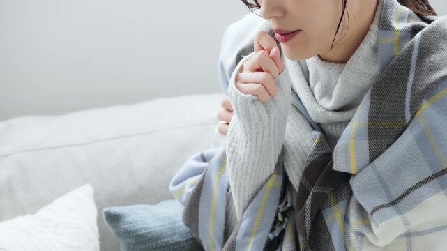 A woman who is sick with a cold