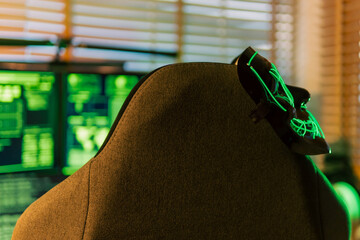 In a dimly lit cyber lair, a glowing hacker mask watches over a desk as encrypted code streams...