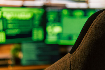 In a dimly lit cyber lair, a glowing hacker mask watches over a desk as encrypted code streams...