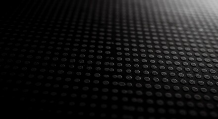 Black surface with raised dots texture pattern