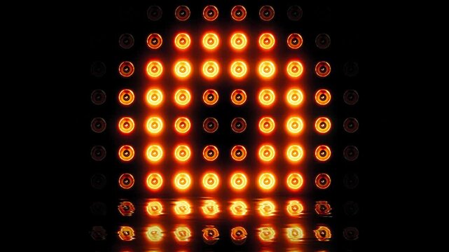 Seamless Loop of Bright Golden Stage Lights with Water Reflection


