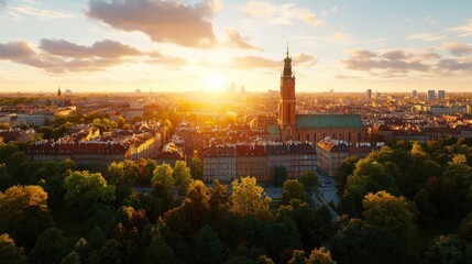 Obraz premium A stunning panoramic view of an urban cityscape du sunset with historic architecture and lush green trees