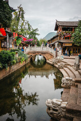 Riverside pavilion with stone bridge in Lijiang Old Town, China