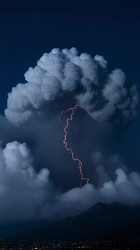 A dramatic lightning strike illuminates a dark cloudy sky. A striking display of nature's power