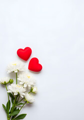 A white background with two red hearts and white flowers. The flowers are arranged in a way that they look like they are hugging each other. Concept of love and affection
