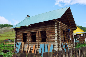 Construction of a traditional house of their logs in Russia. Republic of Bashkiria 07.03.2019.