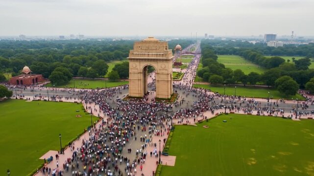 Celebrating Independence Day at India Gate in New Delhi, bustling with people and lush greenery, suitable for patriotic and cultural themes.