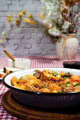 Delicious beef stew called carbonada with corn, potatoes, and carrots simmering in rich tomato sauce