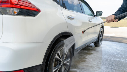Naklejka premium Car at a self-service car wash