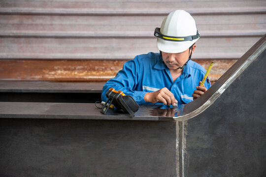 UT, Ultrasonic testing to detect imperfection or defect in welding of steel plate structure in factory. NDT Inspection.