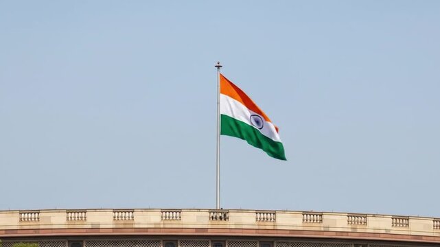 Celebrating Independence Day, the Indian flag flutters above New Delhis parliament building, ideal for national pride and cultural events.