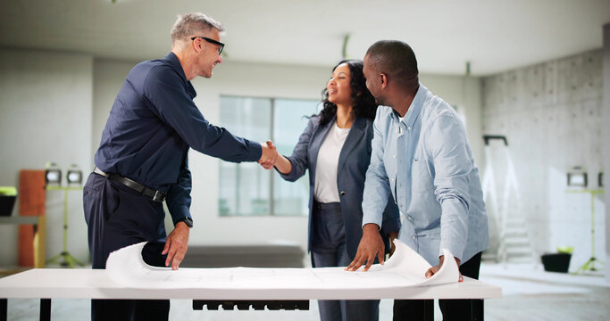 Young Couple Collaborating With Trusted House Designer