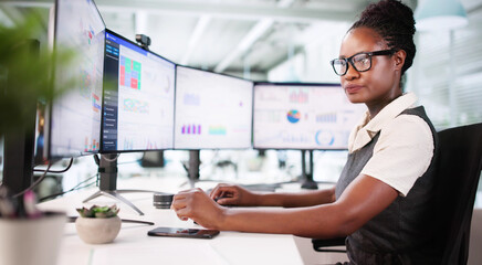 Financial Analyst Examines Stock Performance Graphs