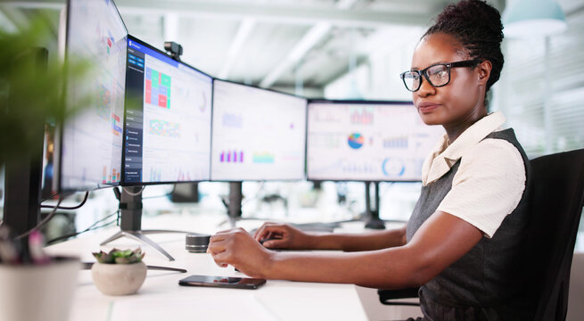 Financial Analyst Examines Stock Performance Graphs