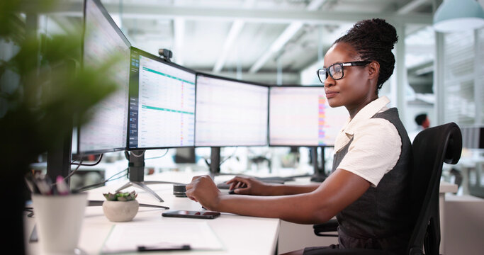 Businesswoman Using Spreadsheet To Investigate Billing Errors