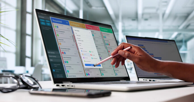 Black Female Project Manager Updating Agile Content