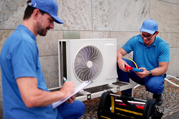 Skilled HVAC Technician Installs New Commercial Air Conditioning