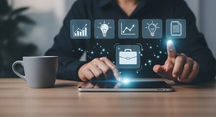 Person using a tablet with digital icons above it and a coffee mug on a wooden table near them