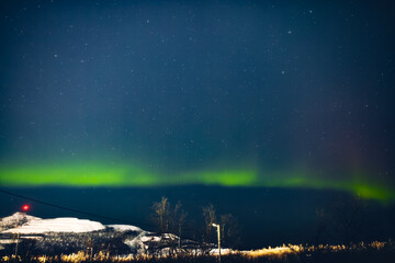 Aurora borealis, polar lights with Milky Way stars.