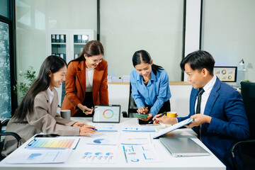Professional teamwork as business colleagues engage in strategy, planning, and discussion,...