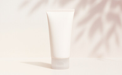 Minimal white skincare tube standing upright on a soft beige background with leaf shadows. Clean and natural setup for cosmetic packaging mockup or beauty branding.