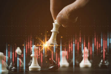 Chess game on chess board on stock market or forex trading graph chart for financial investment...