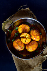 Bengali-style egg kosha – dim kosha, spicy Indian egg curry, traditional Bengali dry egg preparation, rustic homestyle non-veg dish, overhead view
