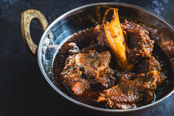 Traditional Bengali-style mutton kosha – spicy slow-cooked Indian goat curry, kosha mangsho, authentic Bengali mutton dish, homestyle non-veg curry, festive meat preparation, rustic top view