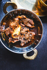 Traditional Bengali-style mutton kosha – spicy slow-cooked Indian goat curry, kosha mangsho, authentic Bengali mutton dish, homestyle non-veg curry, festive meat preparation, rustic top view